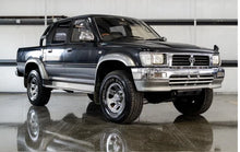 Load image into Gallery viewer, *NEW* FRONT GRILLE HEAD LIGHT RIM (CHROME) SUIT TOYOTA HILUX LN106 4WD 1991-1997